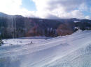 The outside snow has been groomed by a large machine.